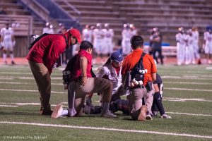 The sports medicine team assesses an injured SRJC player on the field during the game at home against College of the Sequoias on Friday, Oct. 11, 2024.