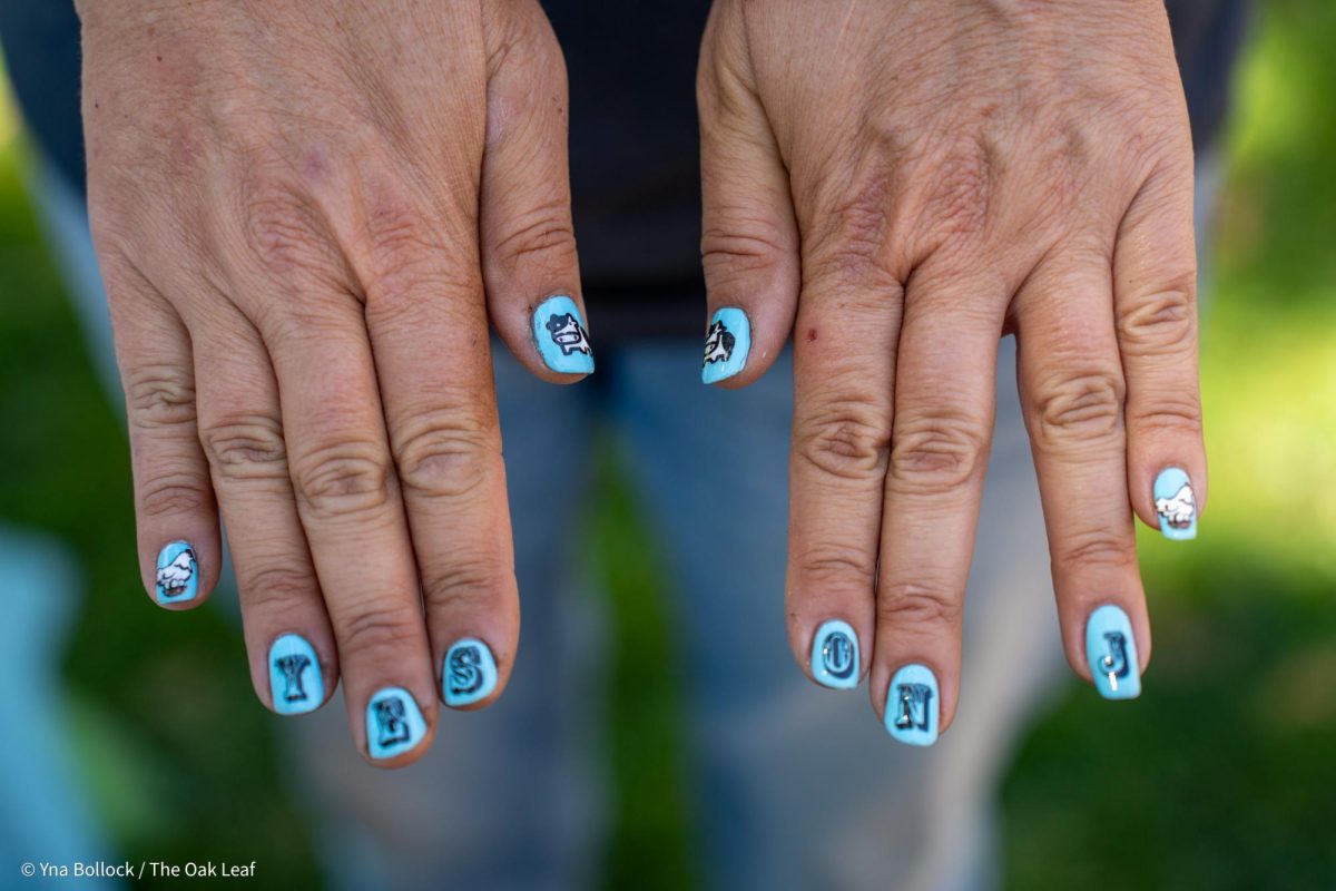 Organizer Carla Cabral shows off her fresh manicure donning 'Yes On J' in the quad on Thursday, August 22, 2024 in Santa Rosa.