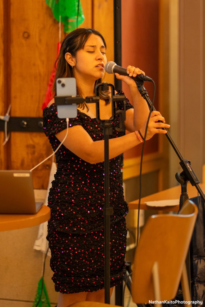 Vanessa Dominguez serenades attendees at the start of the Dia De Muertos celebration in the Bertolini Student Center on Wednesday, Oct. 23. 