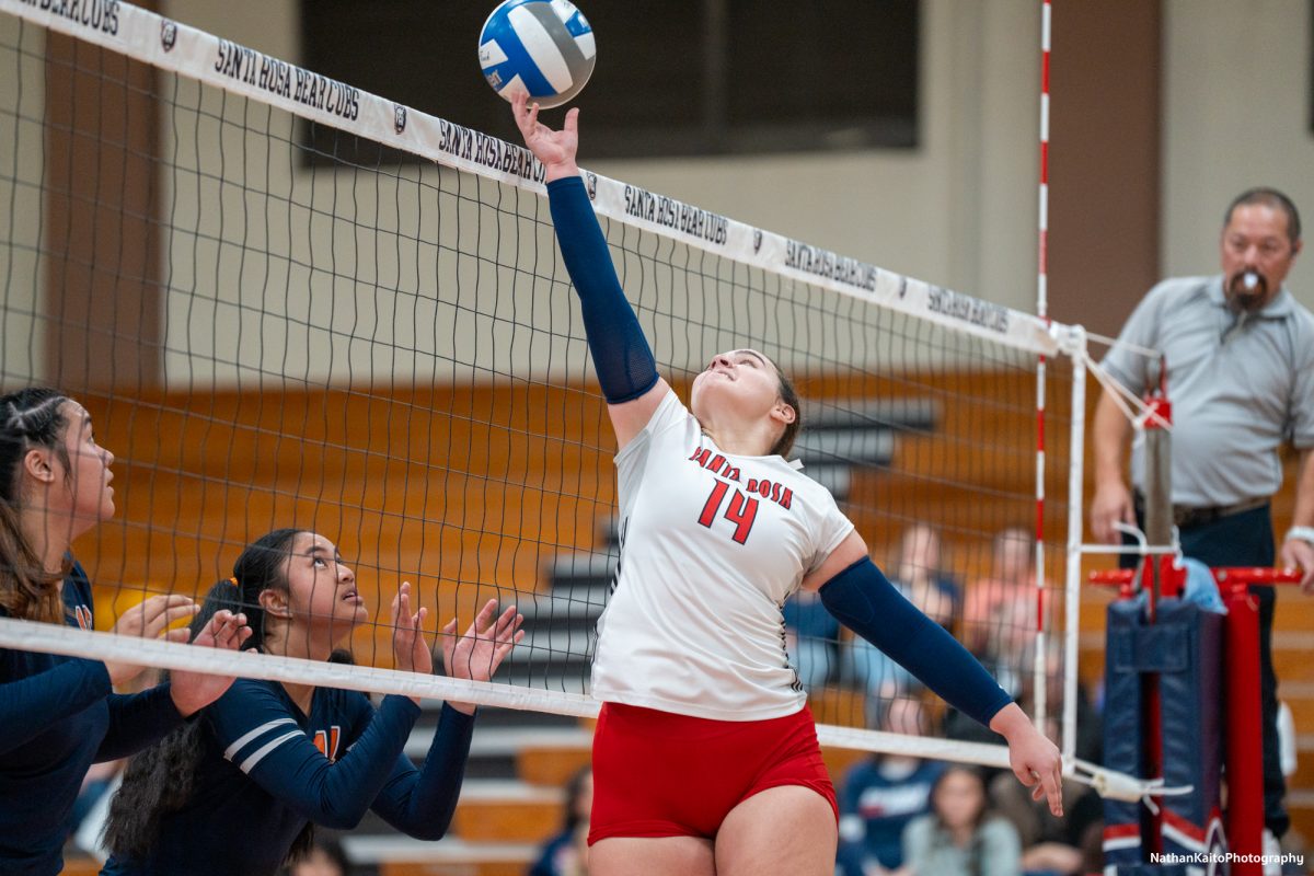 Santa Rosa’s setter Natalie Walsh reaches up to tip the ball against the College of the Sequoias at Haehl Pavilion on Nov. 23rd, 2024. 