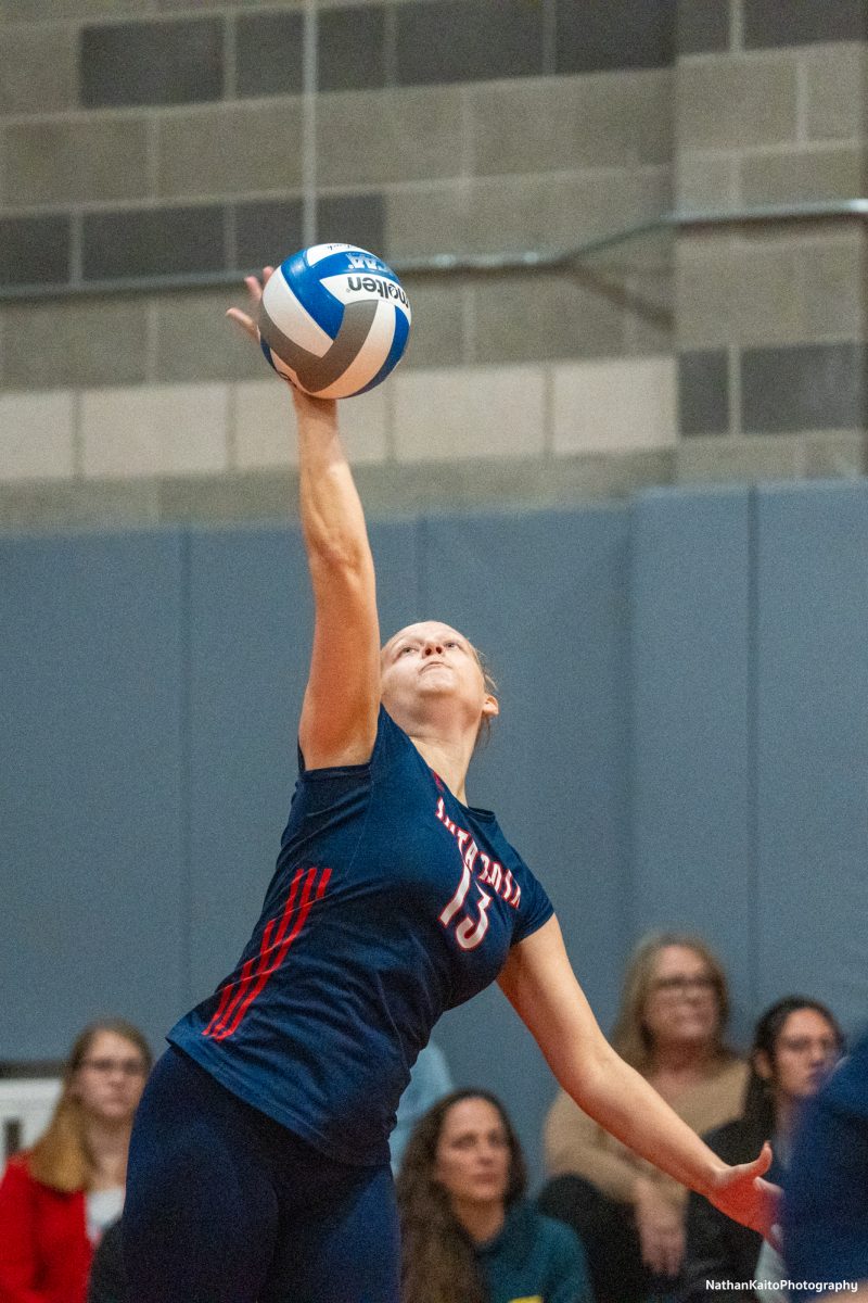 Santa Rosa’s middle blocker Sarah Thornton serves the ball and gets the action started against American River at the American River gym on Tuesday, Nov. 26. 