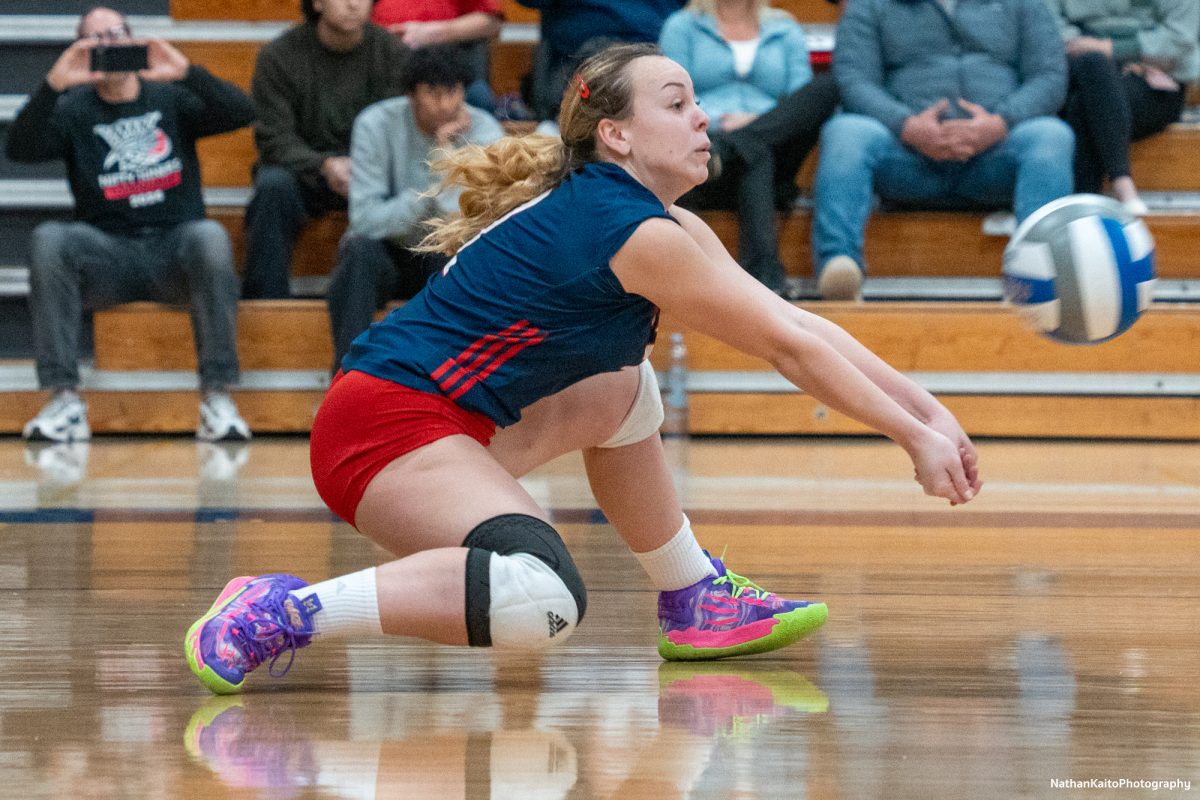 Santa Rosa’s defensive specialist Jaiden Brooner drops low for a dig against the College of the Sequoias at Haehl Pavilion on Nov. 23rd, 2024. 