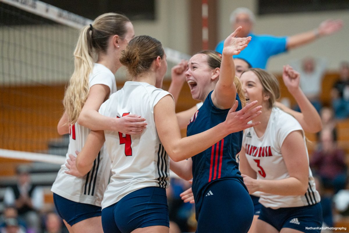 Bear Cubs’ Madison Shaw and Jaiden Brooner celebrates with the rest of the team after scoring a point against San Joaquin Delta at Haehl Pavilion on Friday, Nov. 15, 2024.