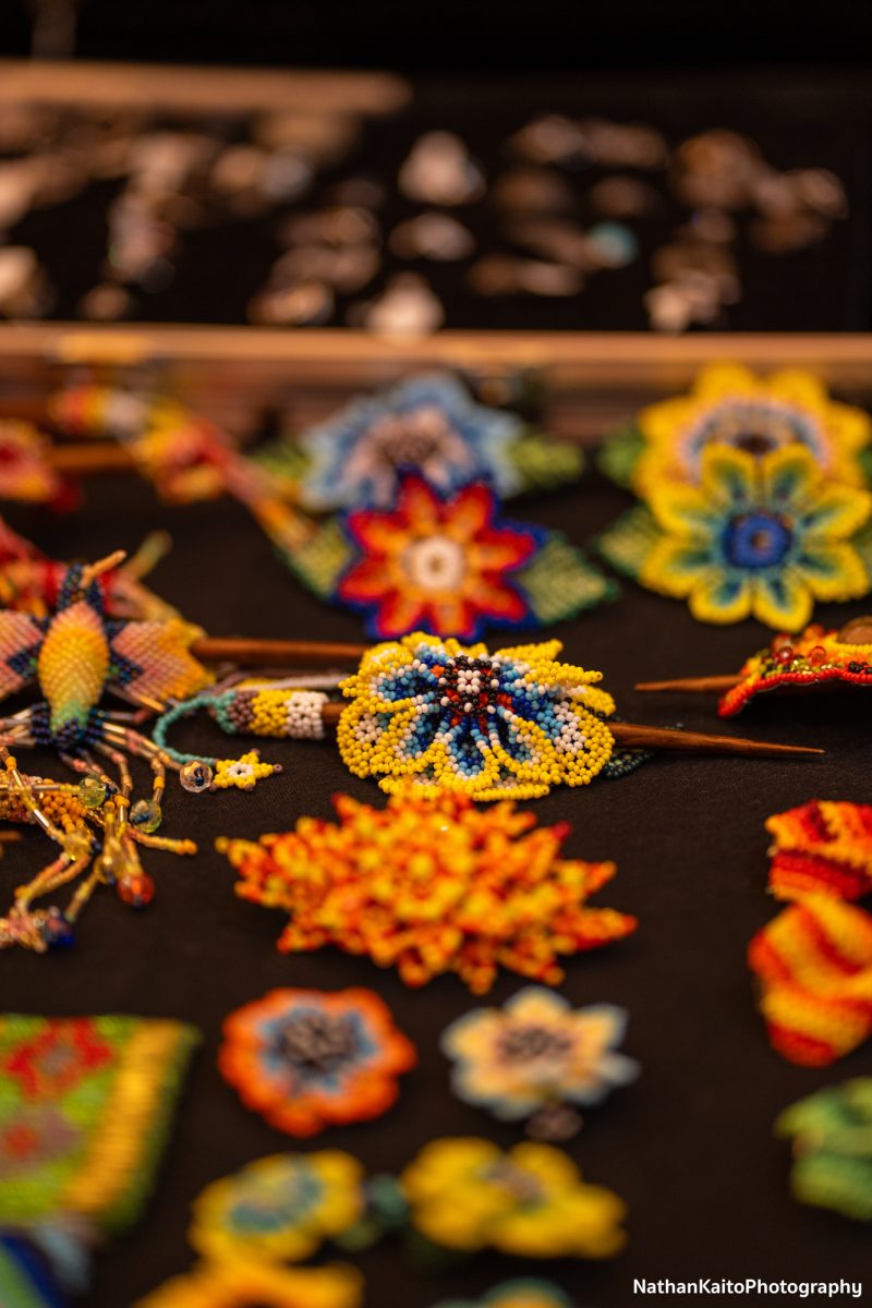 Beautiful flowers made intricately of beads for purchase are displayed at the Dia De Los Muertos event at the Bertolini Student Center on Wednesday, Oct. 23, 2024.