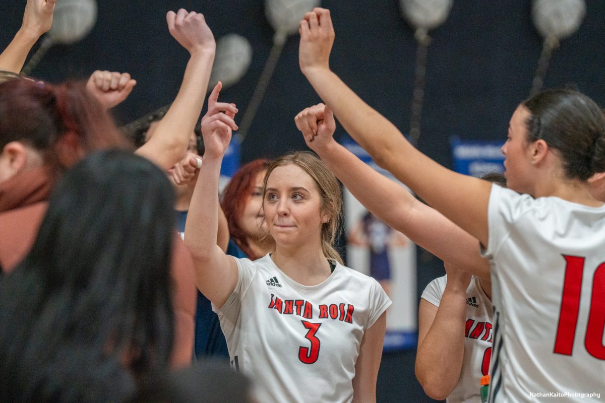 Bear Cubs’ setter Sierra Yates-Bruch stands in the middle of the huddle during a time-out against San Joaquin Delta at Haehl Pavilion on Friday, Nov. 15, 2024.