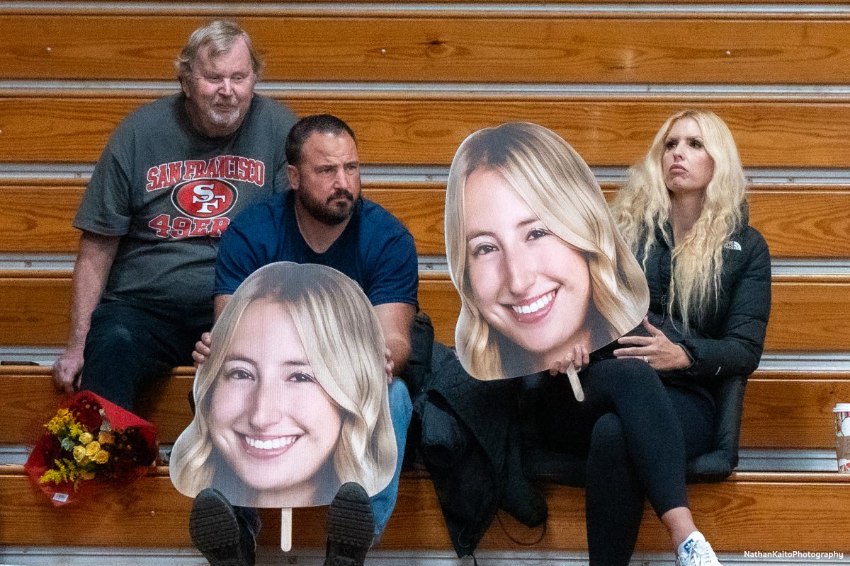 Santa Rosa’s middle/opposite Kiana Walker’s family shows their support from the stands with cut-outs of her face during the game against San Joaquin Delta at Haehl Pavilion on Friday, Nov. 15, 2024.