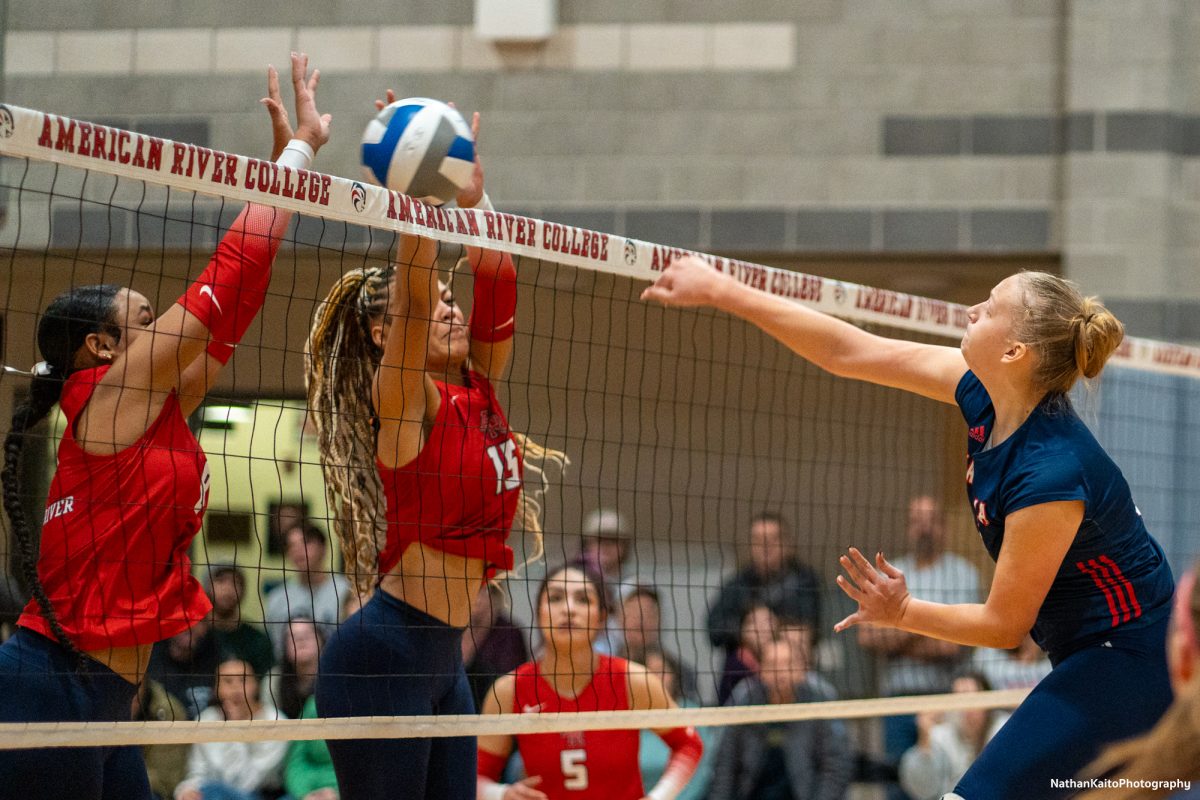 Bear Cubs’ middle blocker Sarah Thornton hits a powerful spike against American River at the American River gym on Tuesday, Nov. 26. 