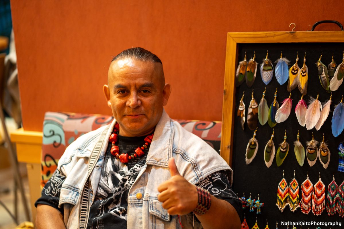 Luis Rodriguez displays pieces of art at the Dia De Muertos festivities at the Bertolini Student Center on Wednesday, Oct. 23, 2024.