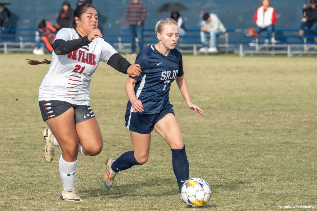 Bear Cubs’ forward/midfielder Paige Tauscher surges forward and brings the ball out of defense as forward, Valerie Latu Nava lags behind against Skyline College at home on Nov. 23, 2024