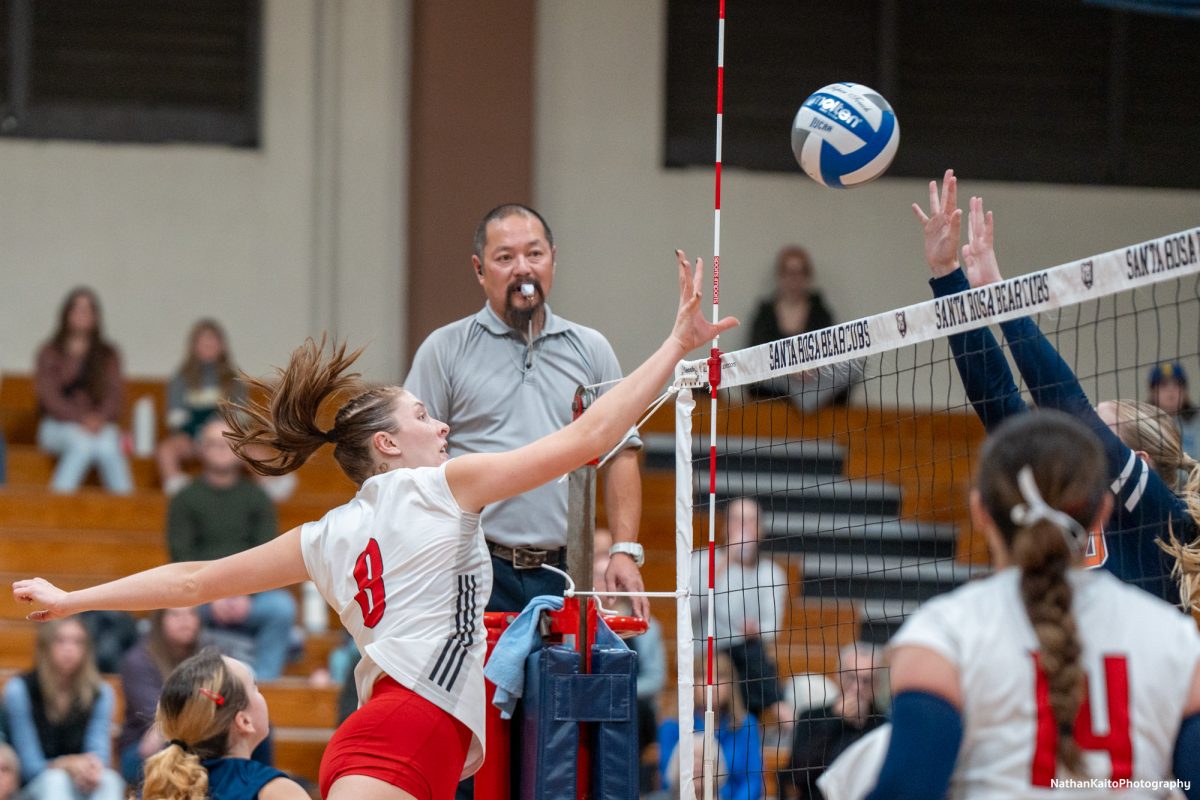 Bear Cubs’ outside hitter Katie Brenninger rises to poke the ball over the rising blockers against the College of the Sequoias at Haehl Pavilion on Nov. 23rd, 2024. 