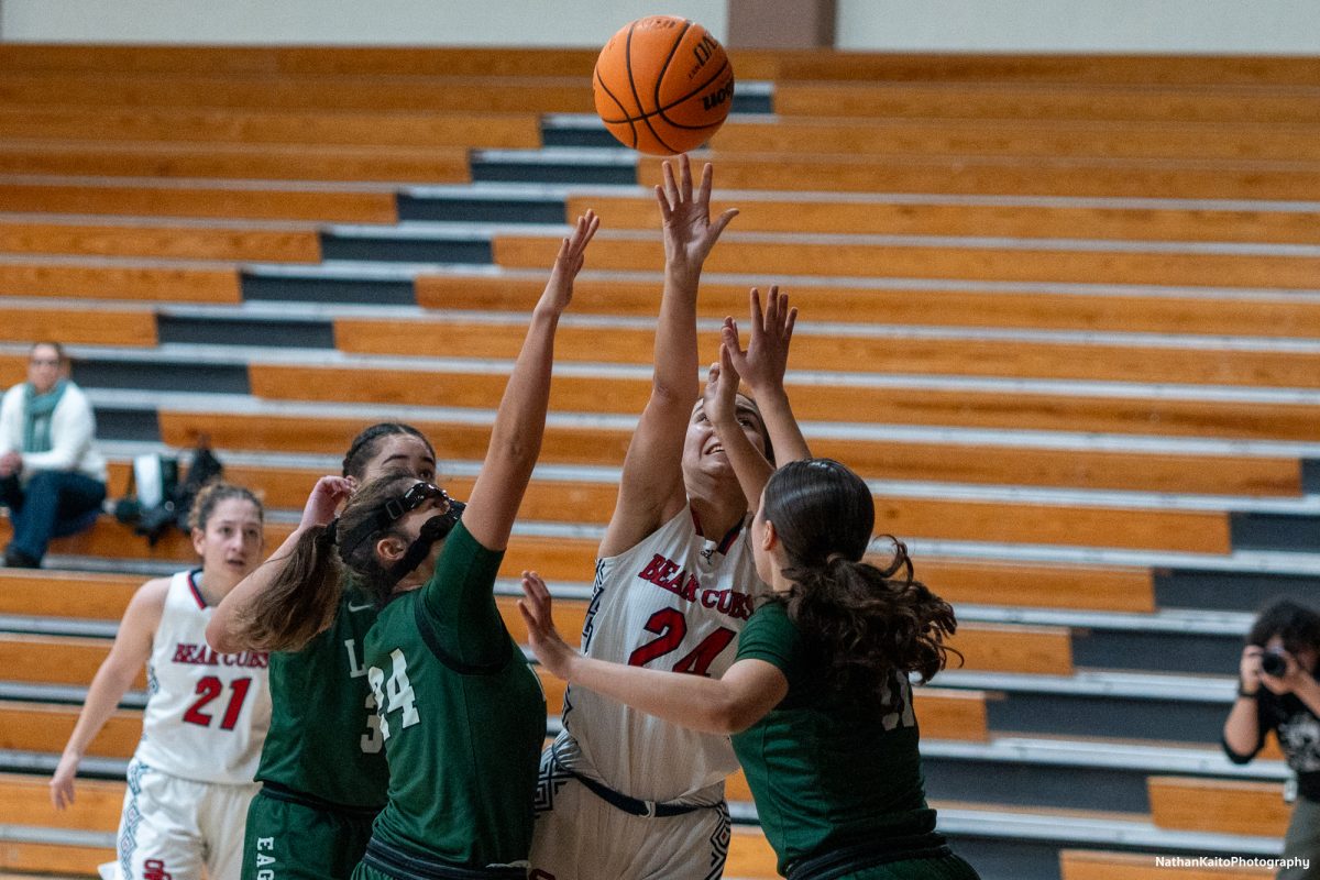 Santa Rosa’s forward Cece Solano rises higher than the Eagles during an intense first quarter against Laney at Haehl Pavilion on Friday, Nov. 22, 2024. 