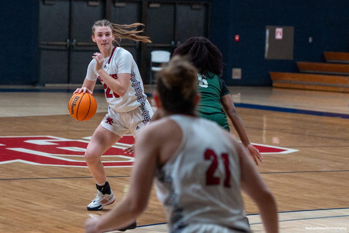 Bear Cubs’ forward Sydney Martin looks to pass the ball to guard, Hailey Webb against Laney at Haehl Pavilion on Friday, Nov. 22, 2024. 