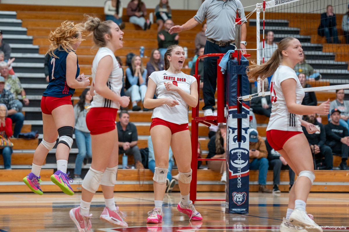  Santa Rosa’s Jaiden Brooner left, Sierra Yates-Bruch, center left, Katie Brenninger, center right, and Sarah Thornton, right, celebrate Brenninger’s emphatic kill against the College of the Sequoias at Haehl Pavilion on Nov. 23rd, 2024. 