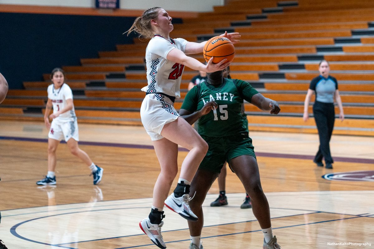 Bear Cubs’ forward Sydney Martin reaches for the net as they look to establish a lead against Laney at Haehl Pavilion on Friday, Nov. 22, 2024. 