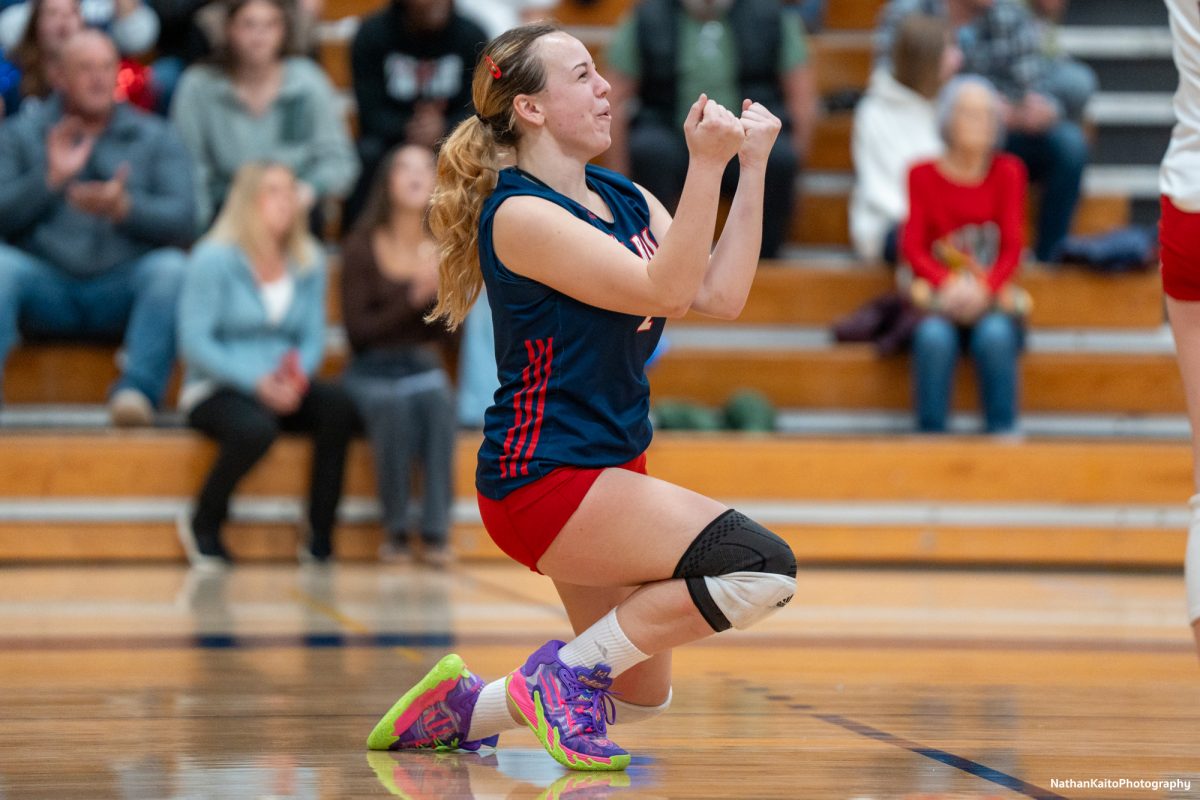 Santa Rosa’s defensive specialist Jaiden Brooner falls to her knees in celebration against the College of the Sequoias at Haehl Pavilion on Nov. 23rd, 2024. 