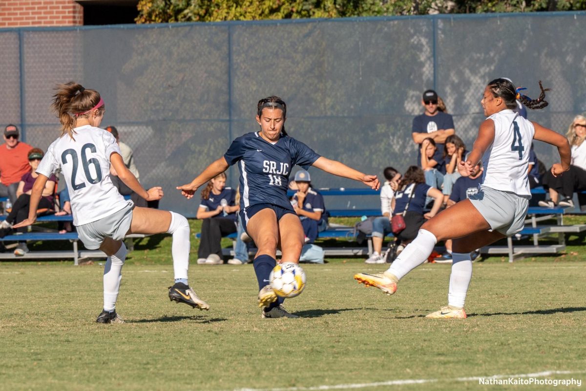 Bear Cubs’ defender/midfielder Natalie Ortiz gets a shot off as Cosumnes River’s midfielder/forward Anisa Camila Gonzalez and defender Leiliana Medrano tries to block it at home on Tuesday, Oct. 29, 2024.