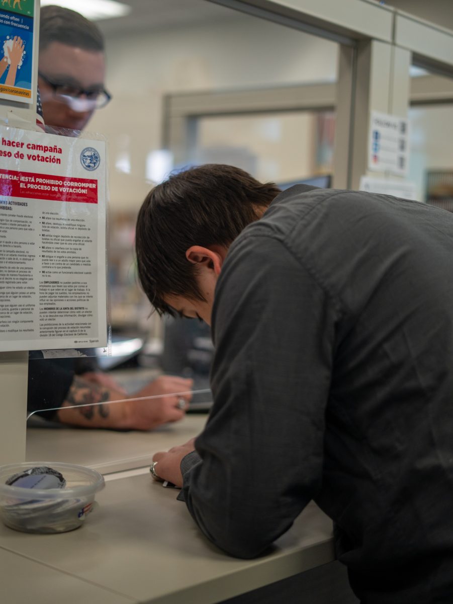 Oak Leaf Reporter Nathan Kaito Morris signs in to cast his vote at the Registrar of Voters in Santa Rosa on Nov. 5th, 2024. 