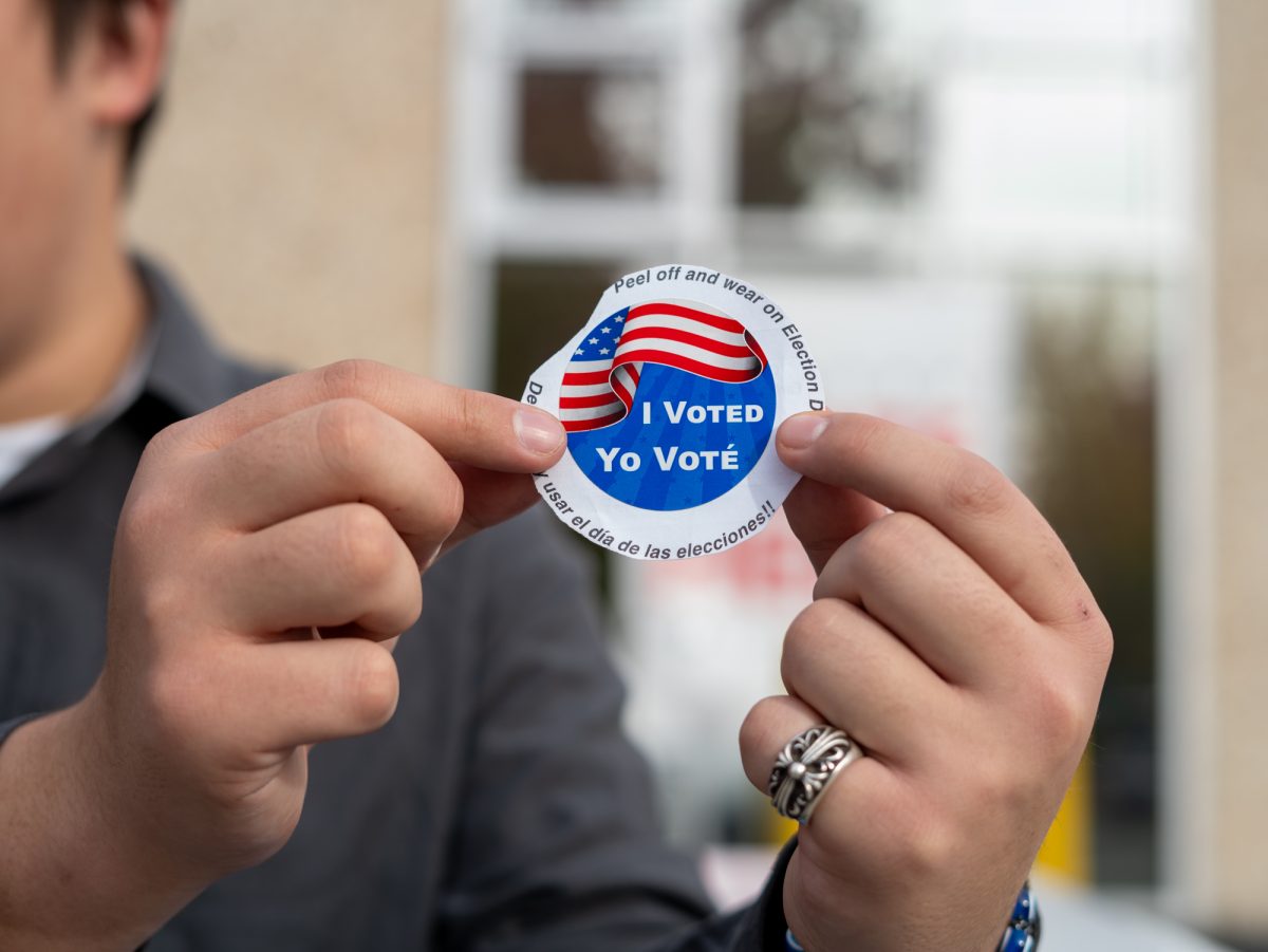 Oak Leaf reporter Nathan Kaito Morris holds up an "I Voted" sticker at the Registrar of Voters in Santa Rosa on Tuesday, Nov. 5th, 2024