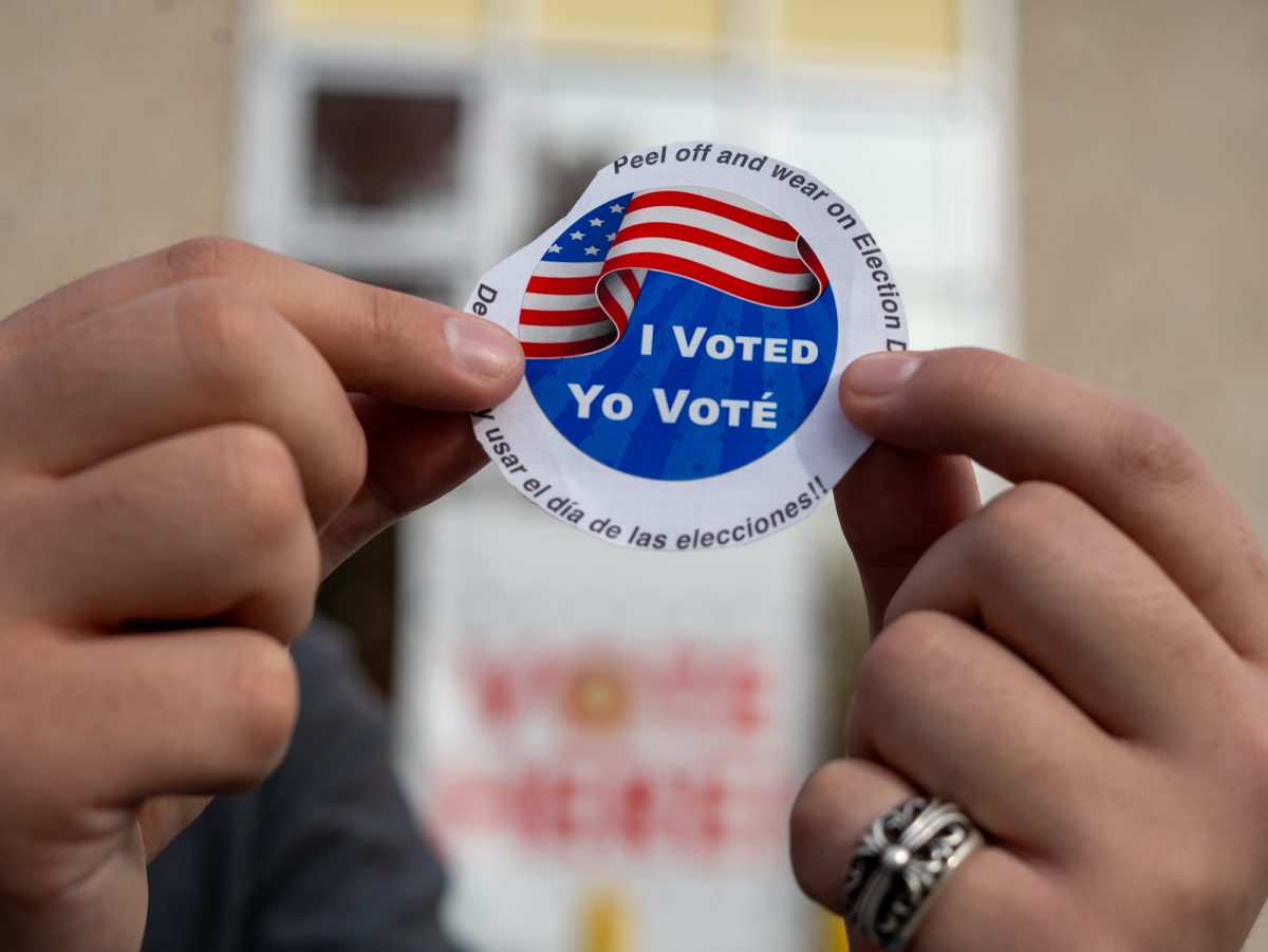 Oak Leaf reporter Nathan Kaito Morris holds up an "I Voted" sticker at the Registrar of Voters in Santa Rosa on Tuesday, Nov. 5th, 2024