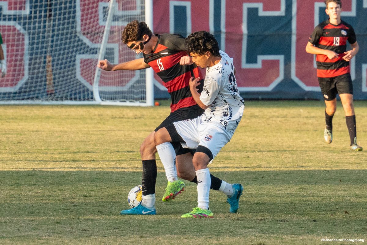 Bear Cubs’ forward Mateo Moyano holds off his marker, deep into the second half at home against Cosumnes River on Tuesday, Nov. 12, 2024. 