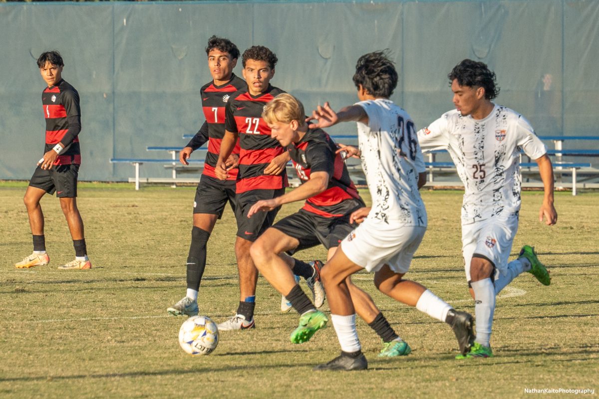 Bear Cubs’ midfielder Anton Berglund tries to make space for himself against Cosumnes River’s defenders, Ezekiel Cruz and Nathaniel Ochoa at home against Cosumnes River on Tuesday, Nov. 12, 2024. 