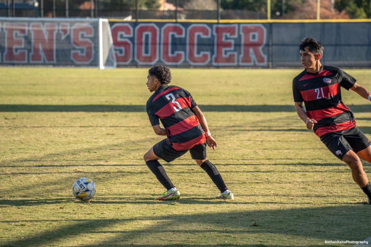 Bear Cubs’ defender Raffino Landford cuts inside as midfielder Jaxon Cho makes an overlapping run at home against Cosumnes River on Tuesday, Nov. 12, 2024. 