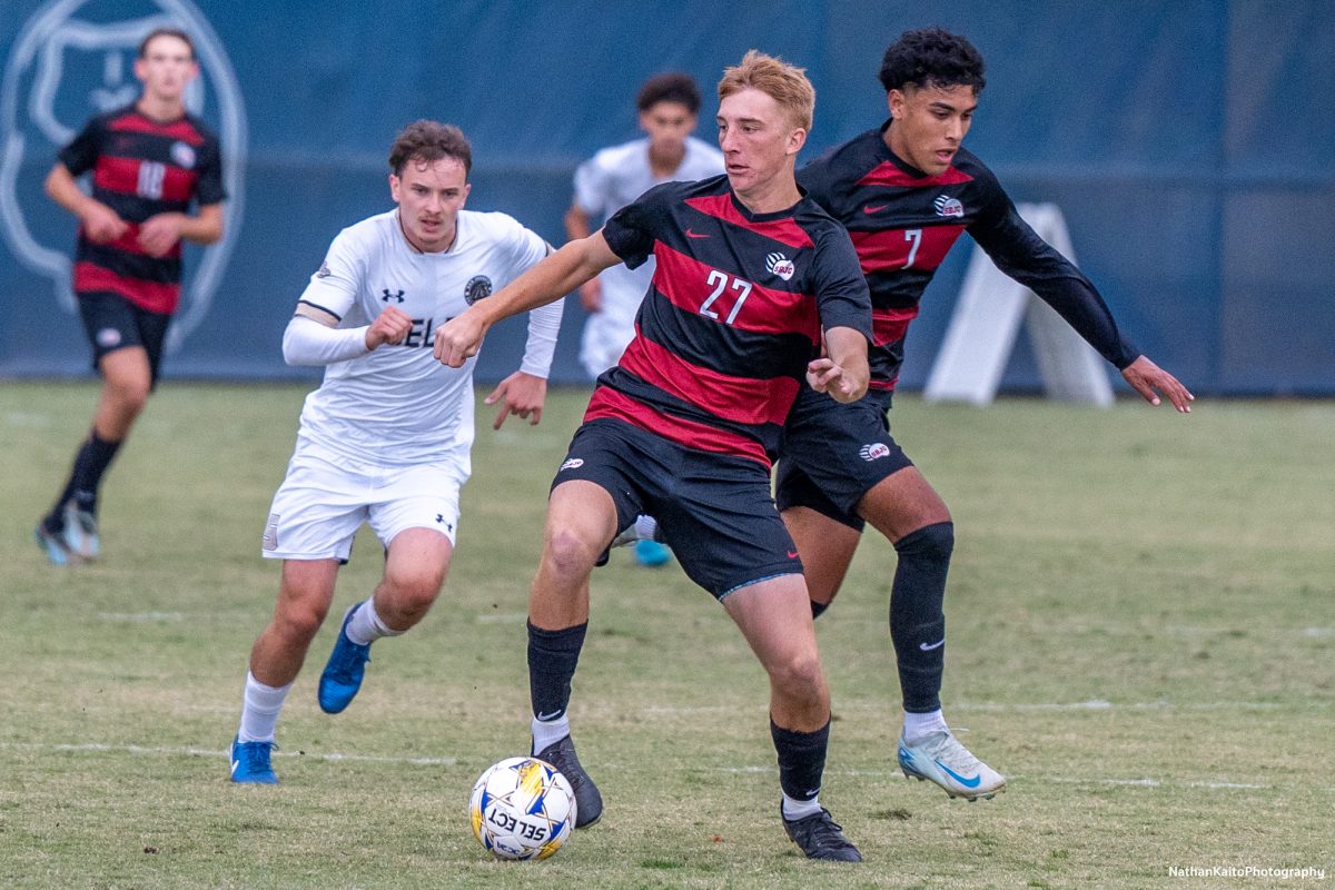 Santa Rosa’s defender Jackson Rader brings the ball forward as teammate, Jerardo Herrera Macias makes a run behind him against San Joaquin Delta at Sypher Soccer Field on Friday, Nov. 1st, 2024