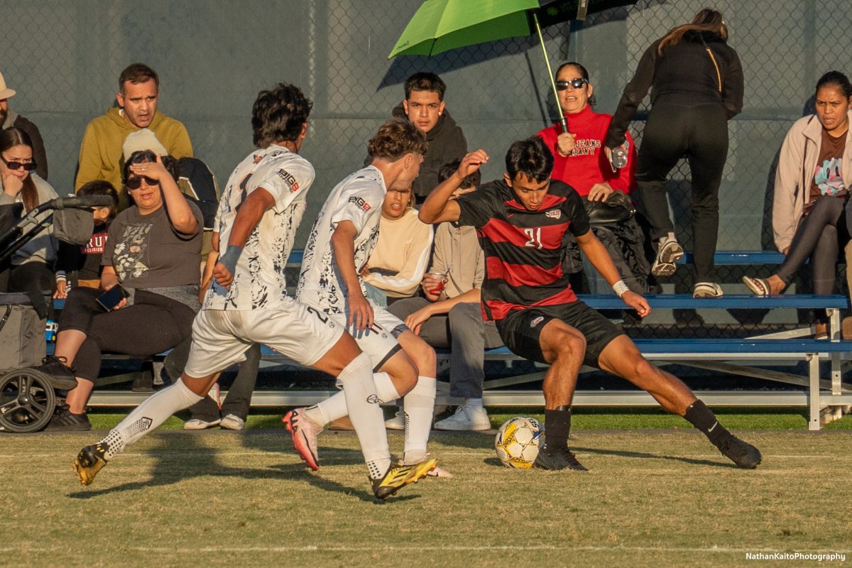 Santa Rosa’s midfielder Jaxon Cho chops back to beat his two markers at home against Cosumnes River on Tuesday, Nov. 12, 2024. 