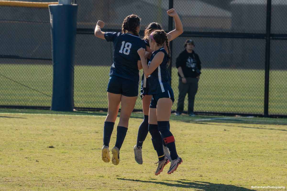 Santa Rosa's midfielders, Natalie Ortiz, left, Ashley Vigil, center, and Olivia Hohnstein, right, jumps into each other before the start of the second half at home against Modesto on Friday, Nov. 8th, 2024