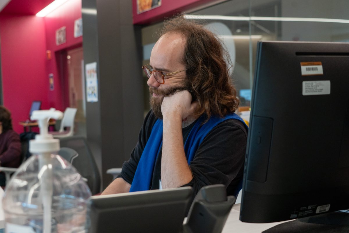 Student Center tutor John Grotting takes a moment during tutoring hours at the Lindley Center for STEM Education on Thursday, Nov. 14, 2024.