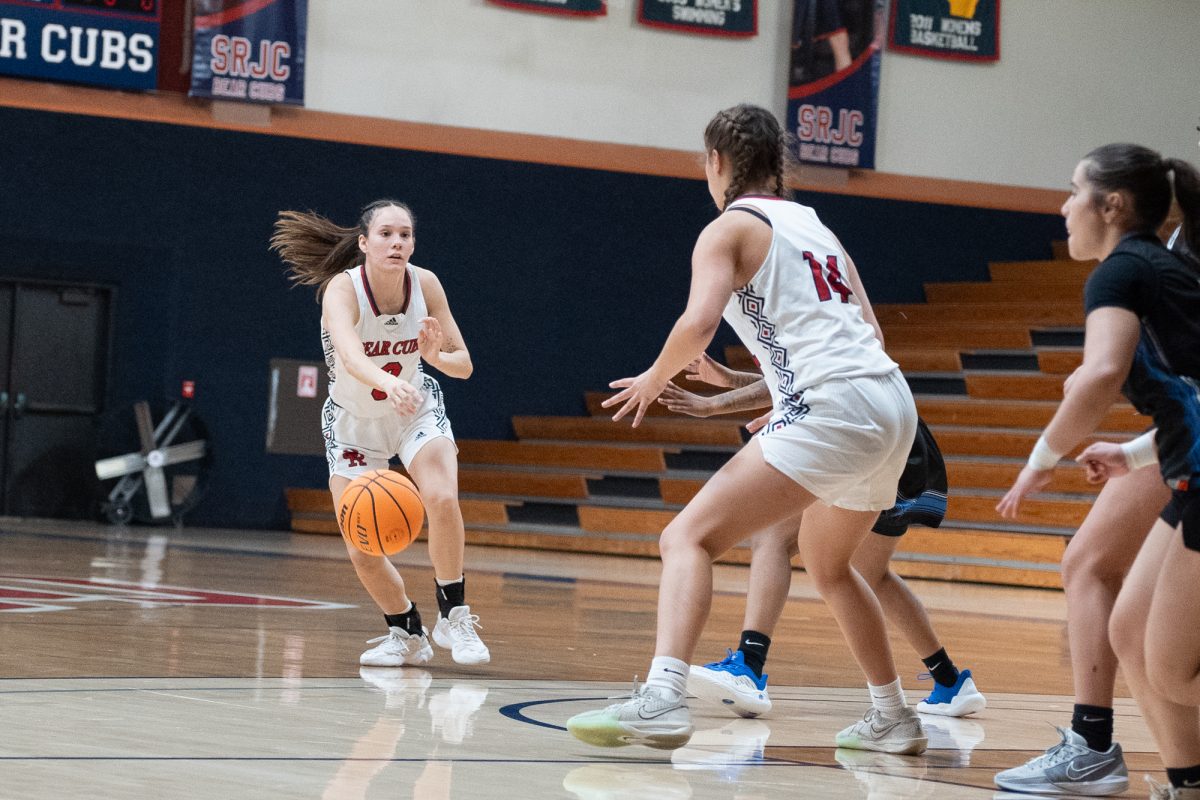 Bear Cubs guard Abigail Tacla, left, attempts a pass to forward Kaia Eubanks during the game against Solano at Haehl Pavilion on Tuesday Nov. 26, 2024.