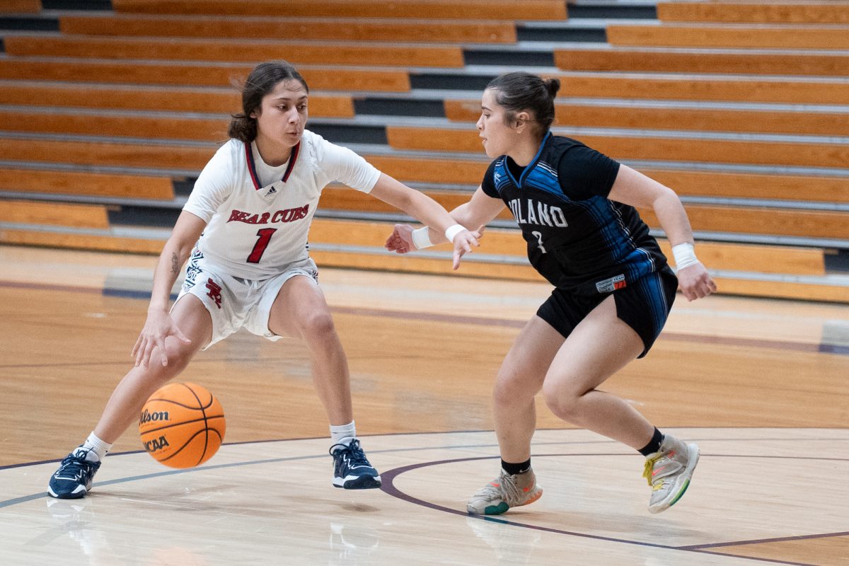 Bear Cubs guard Lindsey Arellano drives the ball, dominating against Solano defense early into the match at Haehl Pavilion on Tuesday Nov. 26, 2024.
