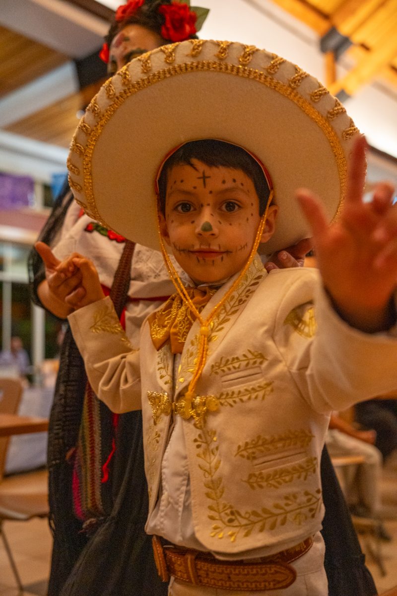 A young attendee participates in the Catrin/Catrina contest held during the Dia De Muertos celebration at the Bertolini Student Center on Wednesday, Oct. 23, 2024.