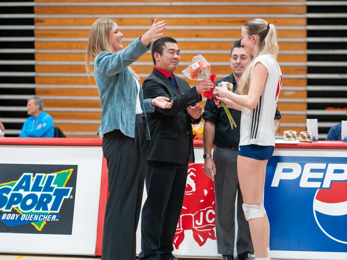 Head coach Ally Sather, left, recognizes middle/opposite Kiana Walker, right, ahead of Sophomore Night at home against San Joaquin Delta on Friday, Nov. 15, 2024.