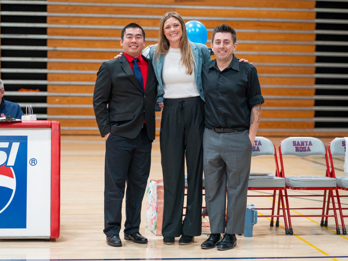 Volleyball head coach Ally Sather, center, poses with her assistant coaches, Tommy Wong, left, and Ryan Hughes, right, ahead of Sophomore Night at home against San Joaquin Delta on Friday, Nov. 15, 2024.