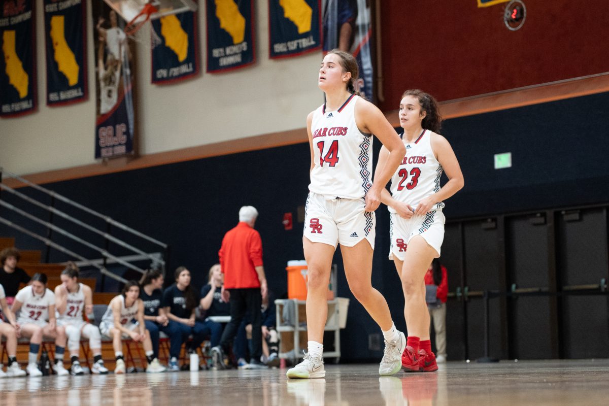 Bear Cubs forward Kaia Eubanks, left, and guard/forward Ivy Gonzalez, right, take a moment during their match against College of San Mateo at Haehl Pavilion on Friday, Dec. 6, 2024.