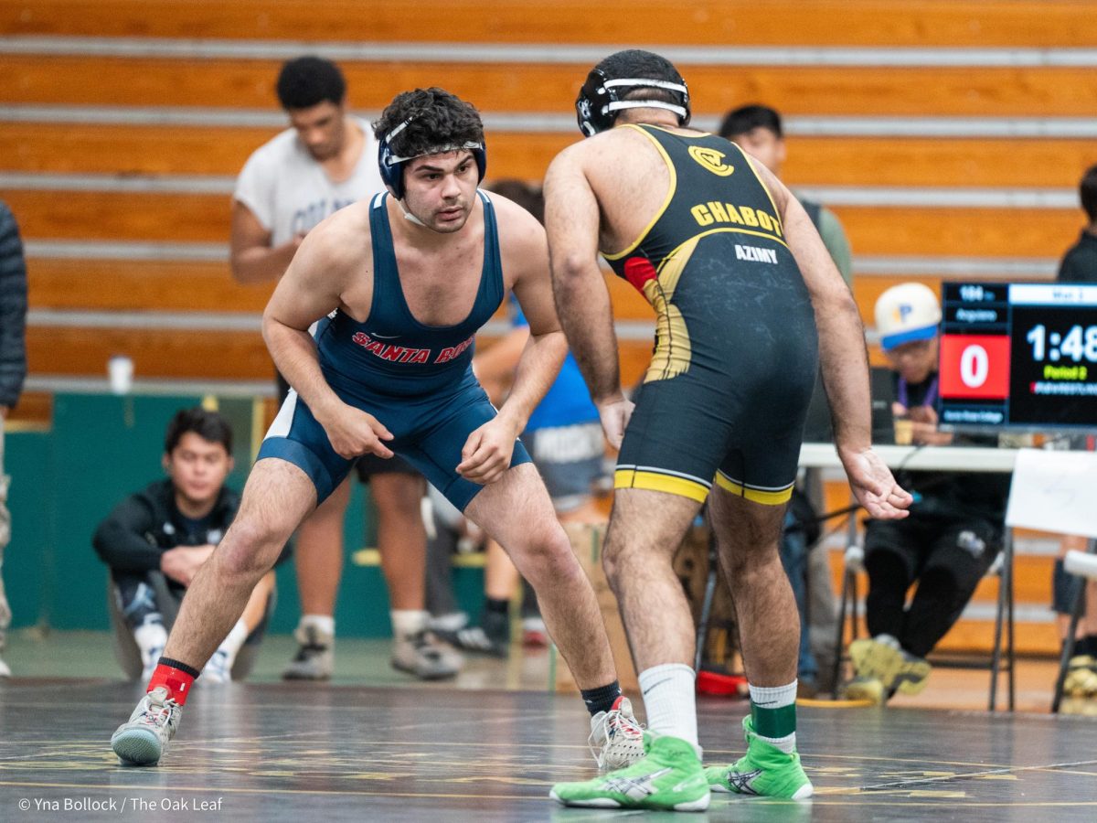 SRJC's Jesus Anguiano (184) prepares to wrestle Chabot's Feroze Azimy in the first round of the CCCAA Norcal Regional Championships in Haehl Pavilion on Saturday, Dec. 7. Anguiano beats Azimy by major decision, 11-3.