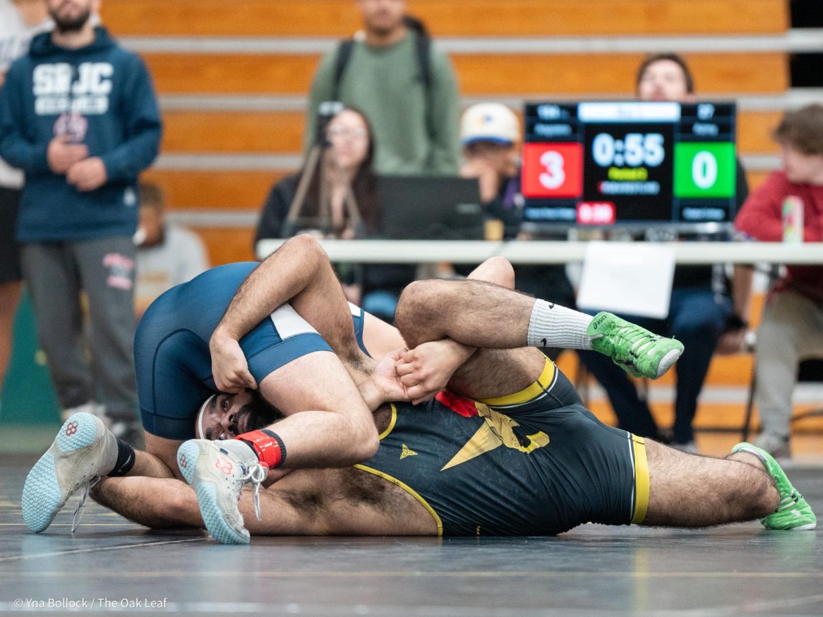 SRJC's Jesus Anguiano (184) locks himself around Chabot's Feroze Azimy in the first round of the CCCAA Norcal Regional Championships in Haehl Pavilion on Saturday, Dec. 7. Anguiano beats Azimy by major decision, 11-3.