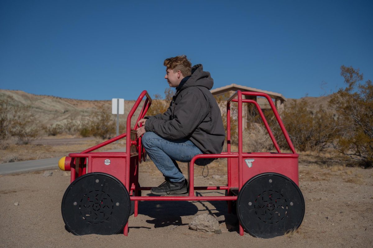 Oak Leaf Reporter Elliott Kennedy steers a small pipe car at the Owl Canyon campsite.