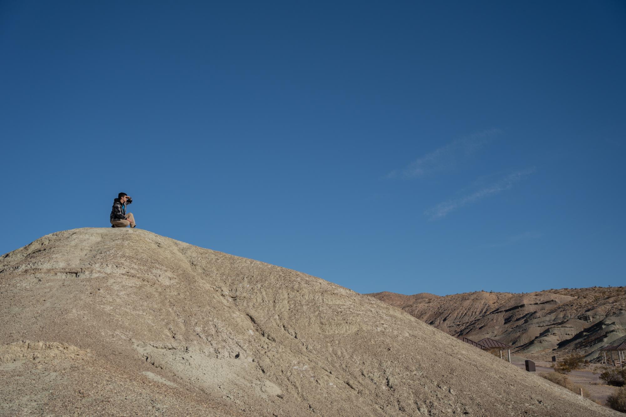 Salvador Sandoval-Garduno looks across the Mojave for potential prospecting locations.