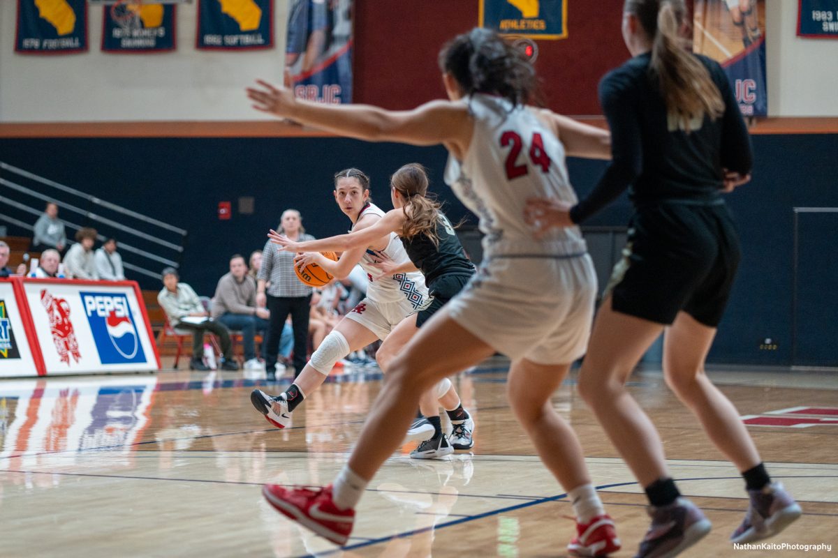 Santa Rosa’s guard Hailey Webb looks for a pass to forward Cece Solano against Butte at Haehl Pavilion on Tuesday, Dec. 10, 2024