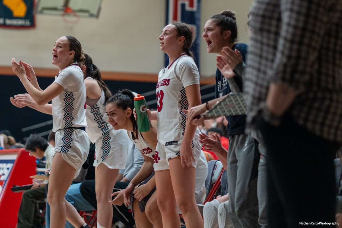 The Santa Rosa bench celebrates crucial points in the latter stages of the match against Butte at Haehl Pavilion on Tuesday, Dec. 10, 2024