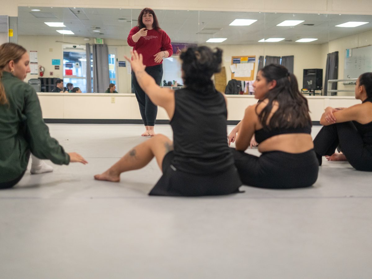 Dance Coordinator Casandra Hillman answers last minute questions before rehearsal begins in the Analy Village dance studio in Fall 2024.