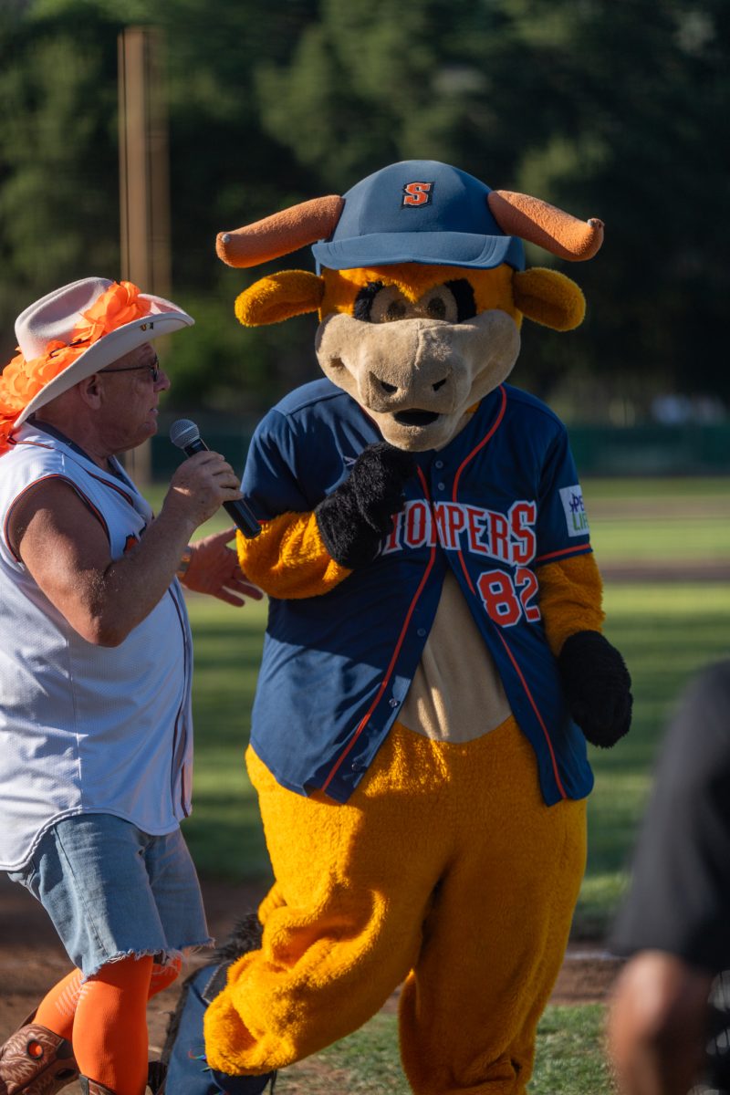 Sonoma Stompers on-field announcer Trey Dunia consults with the Stompers’ mascot Rawhide at Arnold Field before the game against the Petaluma Leghorns on June 29, 2024.