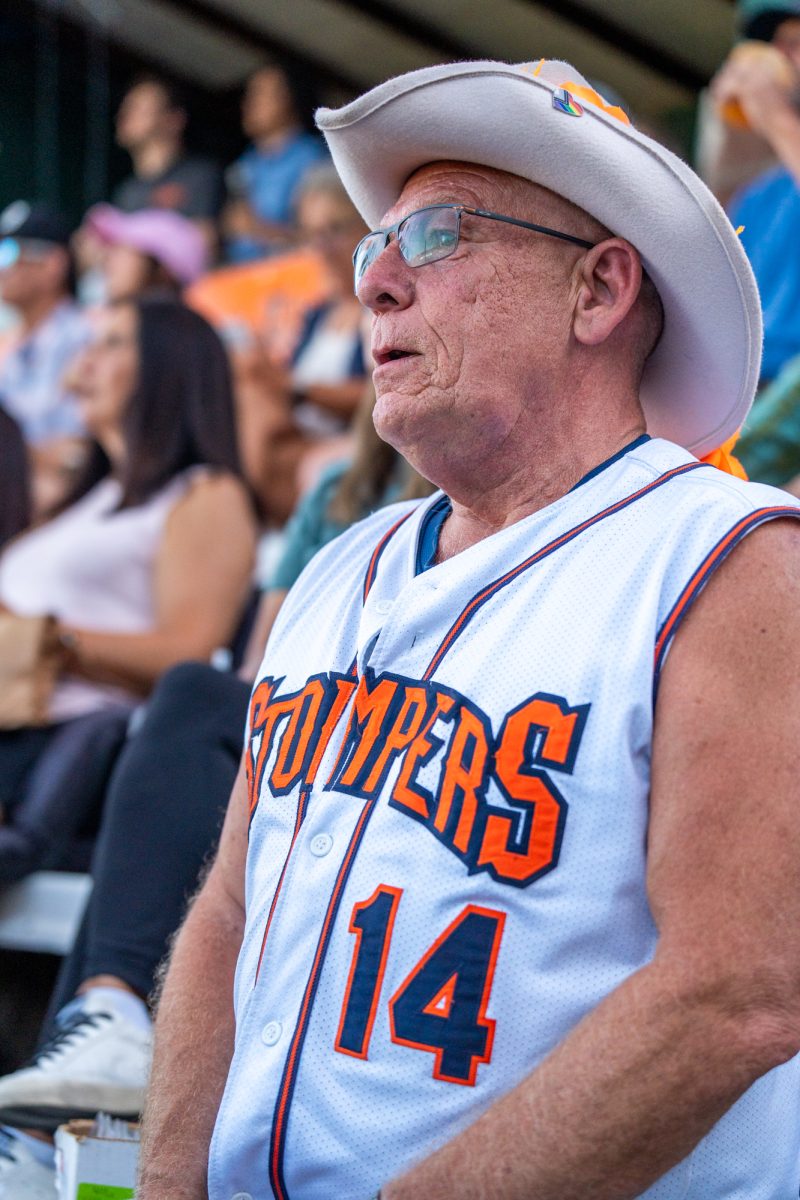 Sonoma Stompers on-field announcer Trey Dunia takes a moment to enjoy a few pitches from the homestands at Arnold Field during the game against the Petaluma Leghorns on June 29, 2024.