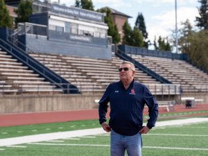 SRJC PA announcer Trey Dunia strolls past the original press box on Bailey Field on Nov. 2, 2024