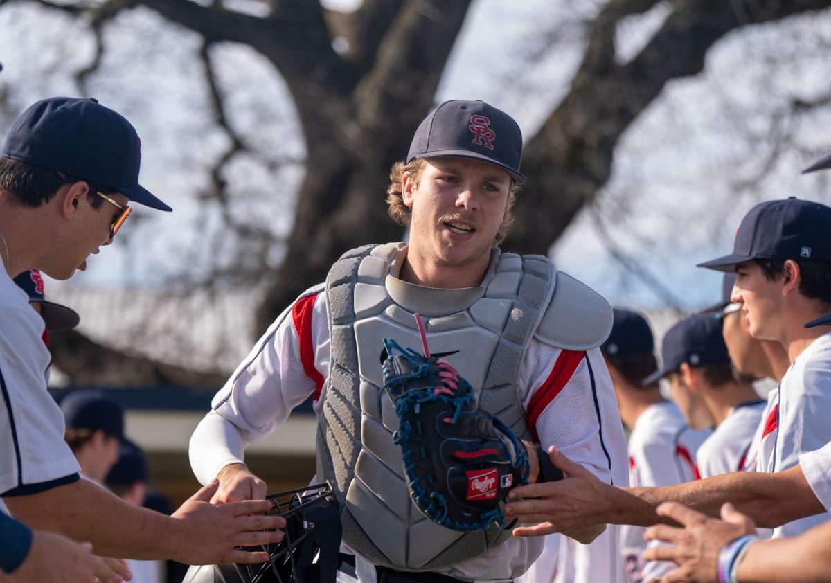 Catcher Mason Cox runs out to his position as the starting lineup is announced at home against Chabot on Friday, Jan. 24th, 2025