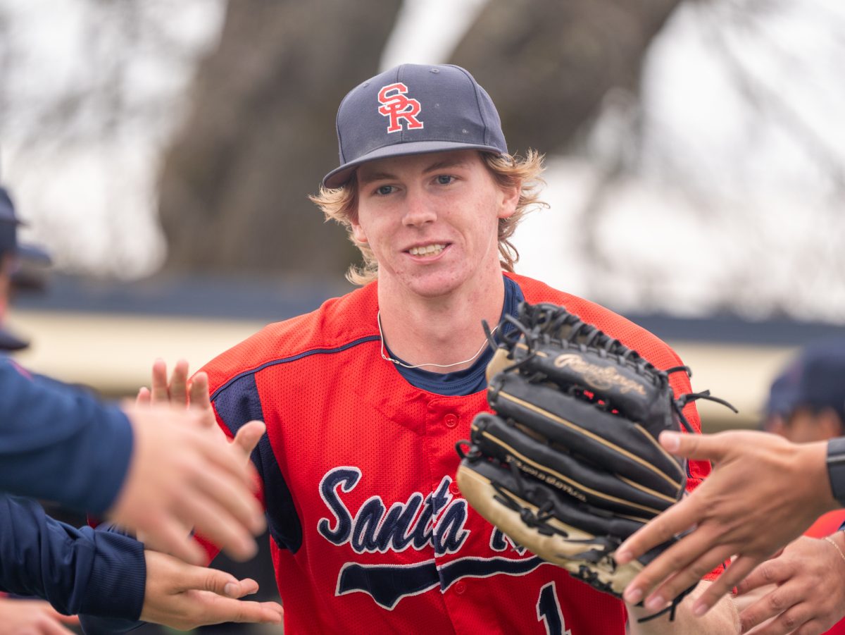 Santa Rosa right fielder Ayden Herrguth jogs out to his position ahead of the game against Los Medanos at home on Wednesday, Jan. 29, 2025.