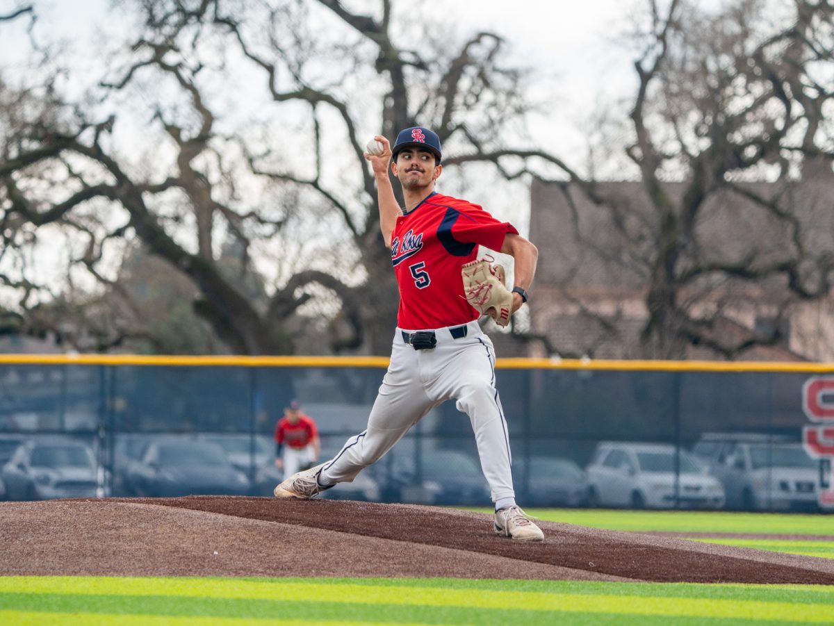 Santa Rosa's starting pitcher Evan Sandoval winds back for a pitch against Los Medanos at home on Wednesday, Jan. 29, 2025.