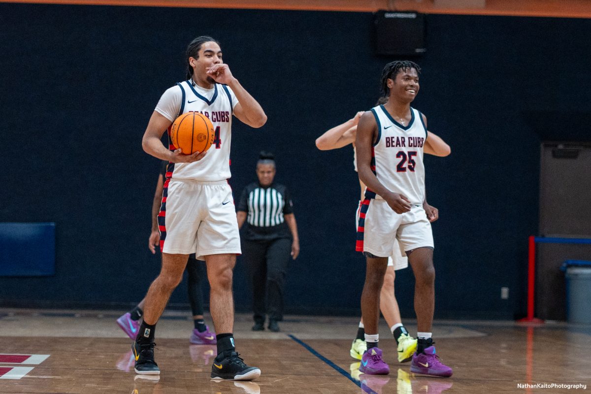 Bear Cubs’ forward Vincent Jackson, right, and guard Gavin Cook-Whisenton, left, react in a mix of shock and happiness after the game, following an attempted buzzer-beater from the Panthers bounded off the rim at Haehl Pavilion on Tuesday, Jan. 14, 2025.